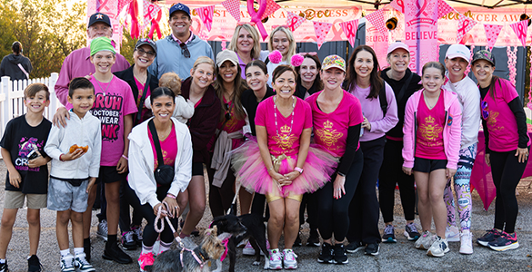 Austin Group in Pink in front of Pink Tent