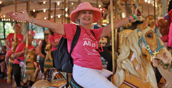 San Francisco Walk Woman in pink on carousel