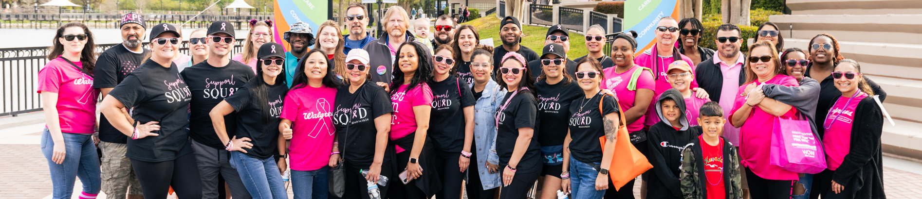 Large group of team members posing at a Komen event