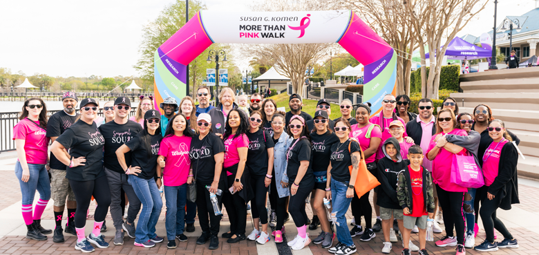 Large group of team members posing at a Komen event