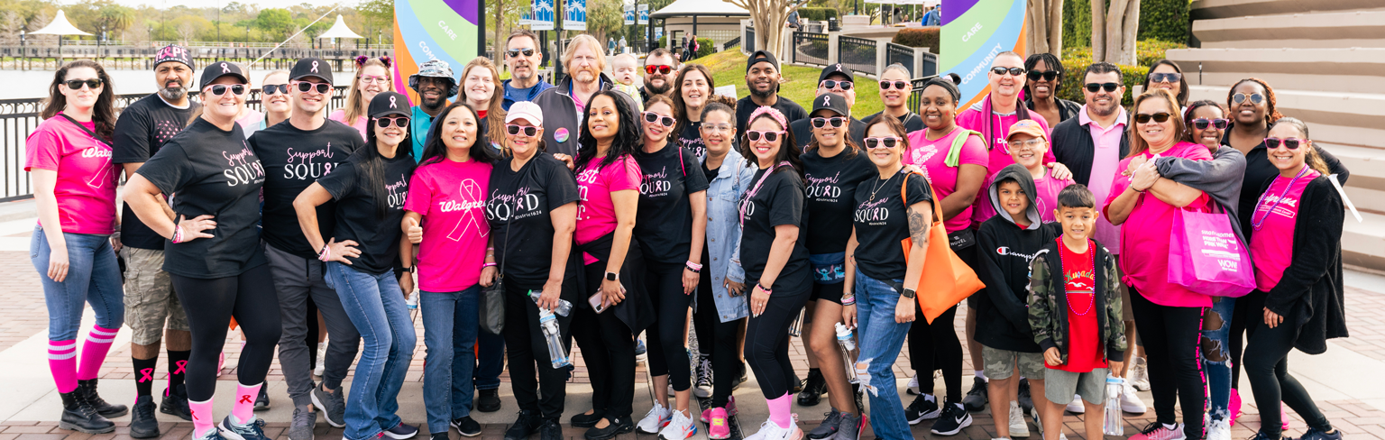 Large group of team members posing at a Komen event