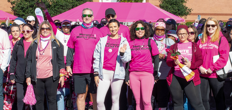 Large group of team members posing at a Komen event