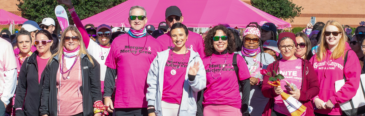 Large group of team members posing at a Komen event