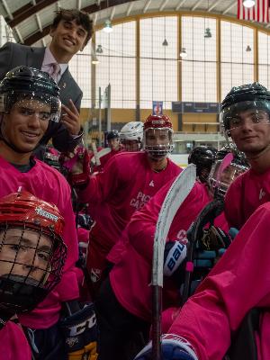 Thomas London with Puck Cancer players.